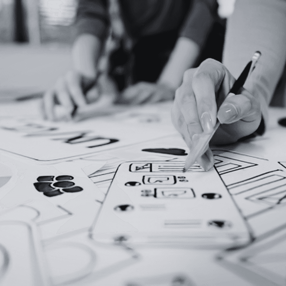 Someone sketching wireframes and UX designs